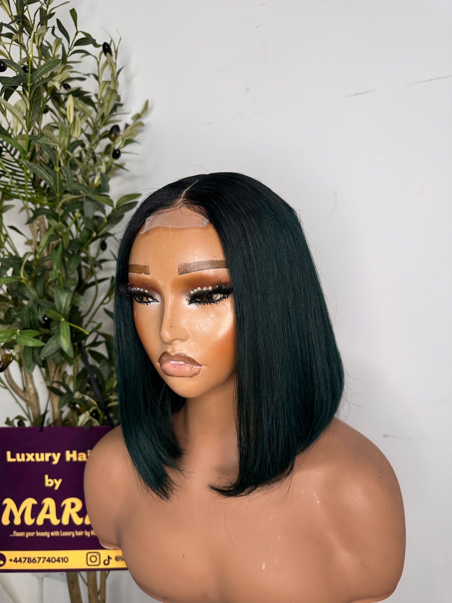 10 inches Natural dark green with dark root Bob unit with 2by6 closure( 2by6). Beautiful Bob uniy.